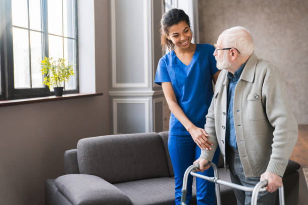 woman helping elderly man