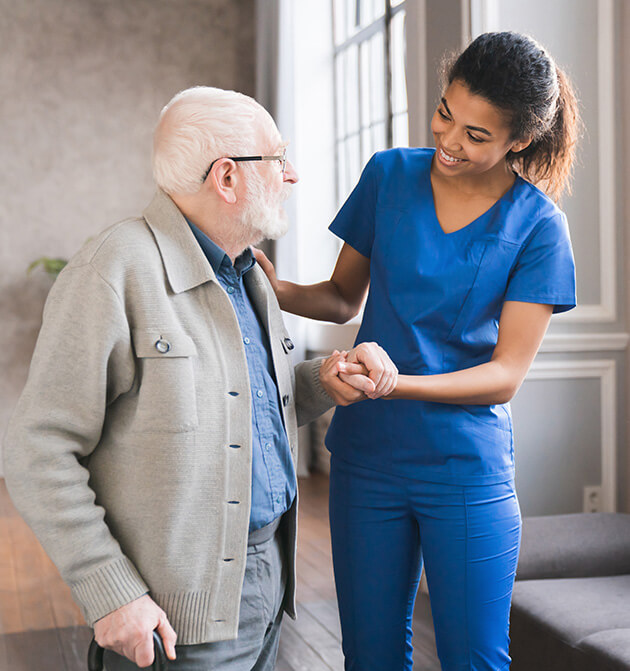 Nurse helping an elderly man 